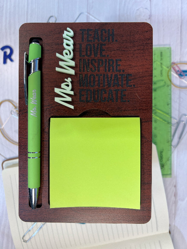 Wooden desk organizer with pen, sticky notes, and motivational quote on a white background