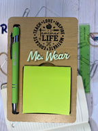 Wooden desk organizer with green sticky notes and pen on a white surface. From She Shed Designs