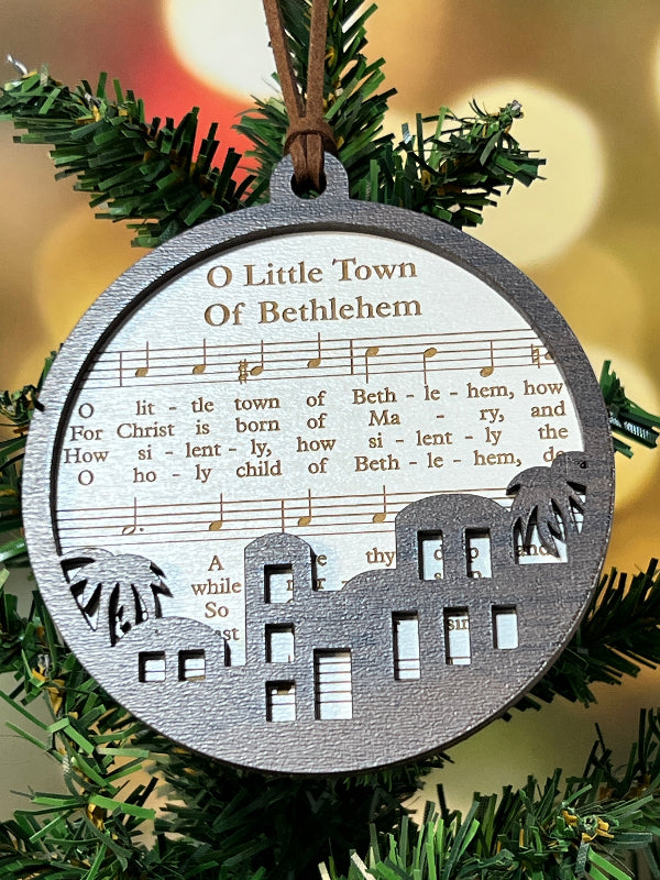 Decorative ornament with sheet music design on a Christmas tree. O little town of Bethlehem. Hymn Sheet Music Ornament