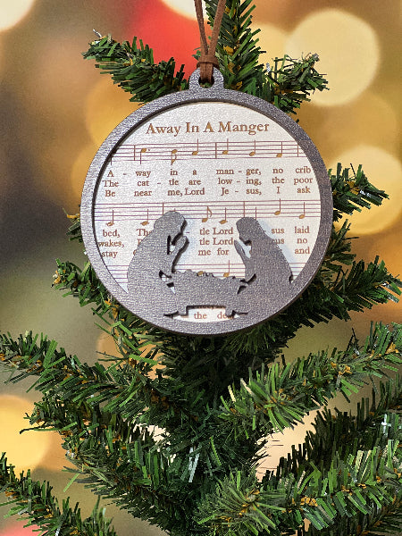 Decorative Christmas ornament with musical lyrics on a Christmas tree. From She Shed Designs