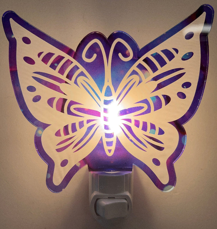 Butterfly-shaped night light with Purple and blue design on a white background. From She Shed Designs.