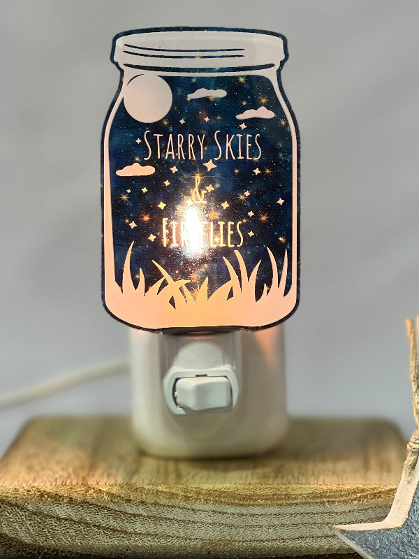 Decorative night light with 'Starry Skies & Fireflies' on a starry night background.
From She Shed Designs.