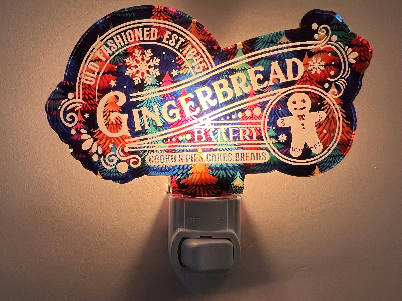 Handcrafted acrylic nightlight with a gingerbread bakery theme, featuring an engraved design and a LED bulb, on a white background. From She Shed Designs.