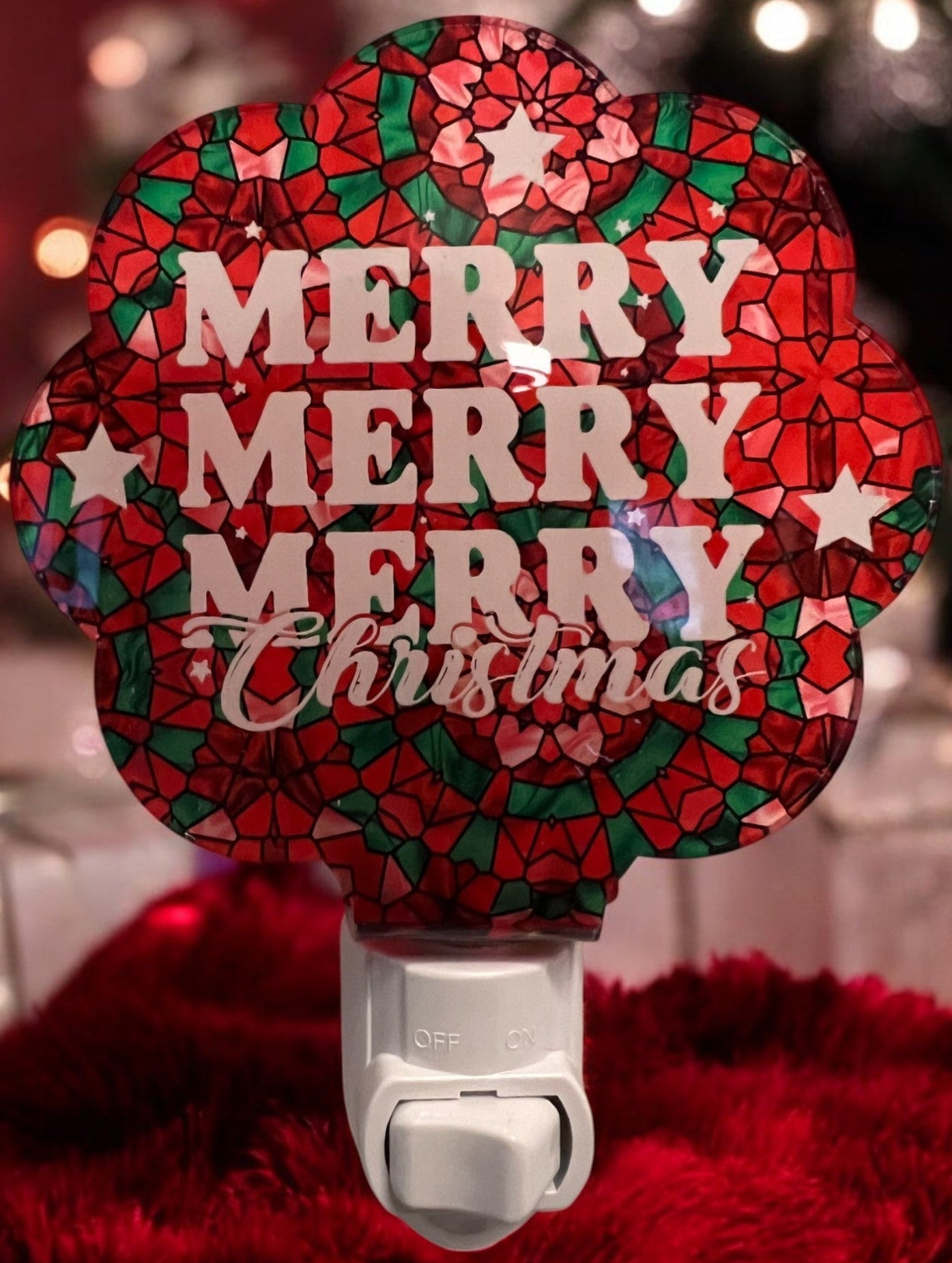 Handcrafted acrylic nightlight with a 'Merry Merry Christmas' design in red, green, and pink, glowing in a dark setting. From She Shed Designs.