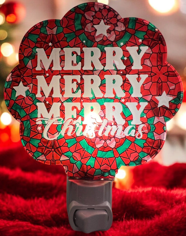 Handcrafted acrylic nightlight with a 'Merry Merry Christmas' design in red, green, and pink, glowing in a dark setting. From She Shed Designs.