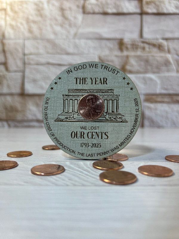 Circular Magnet with penny on linen patterned wood. From She Shed Designs