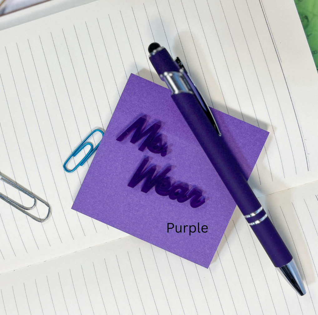 Purple pen and sticky note on a notebook page. From She Shed Designs