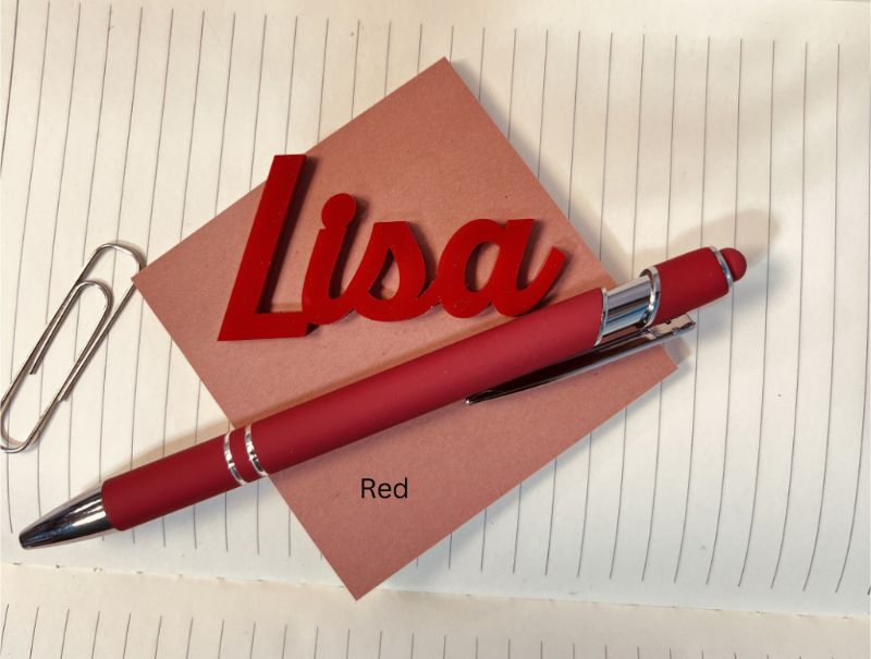 Red pen and name card with 'Lisa' on a lined paper background. From She Shed Designs