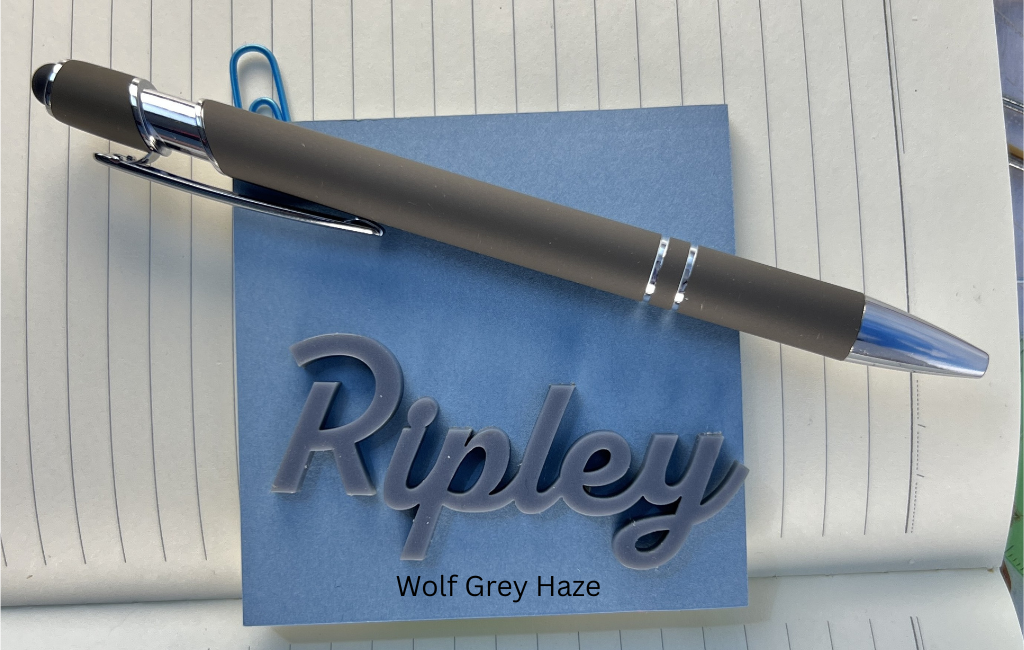 Pen on a blue notepad with 'Ripley' branding. From She Shed Designs