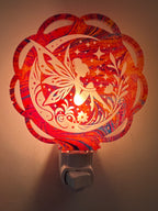 Decorative night light with fairy design with Pink and blue paint pour coloring. From She Shed Designs.